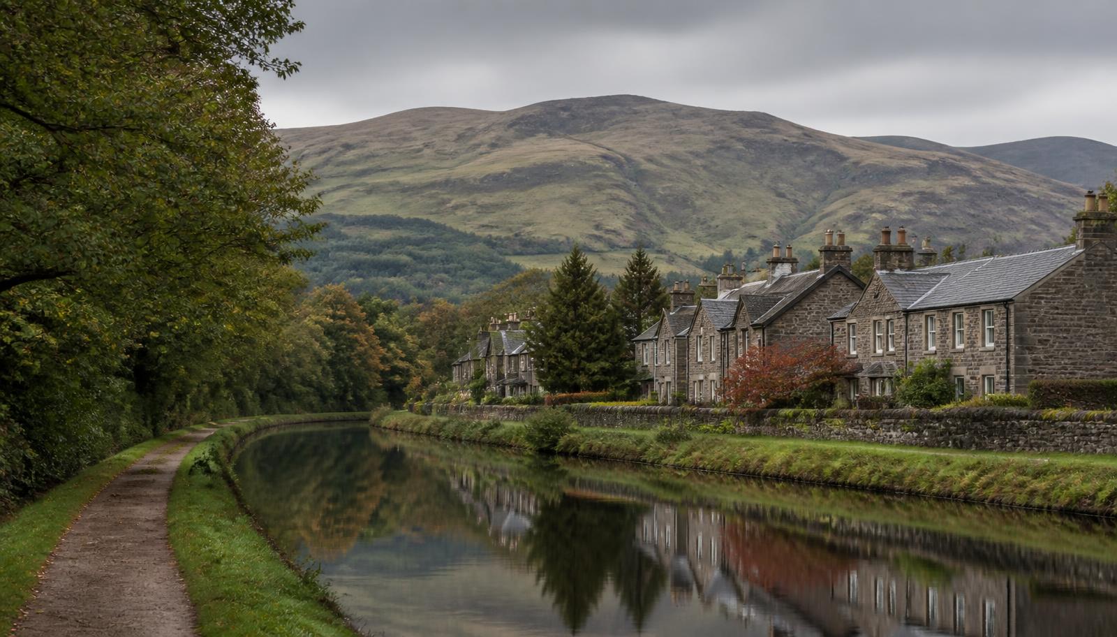 East Dunbartonshire canal towpath with the Campsie Fells rising behind stone houses