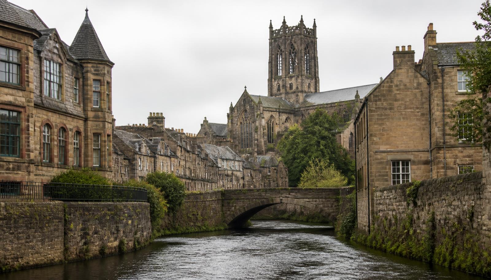 Paisley in Renfrewshire with the abbey tower and sandstone buildings beside the White Cart Water
