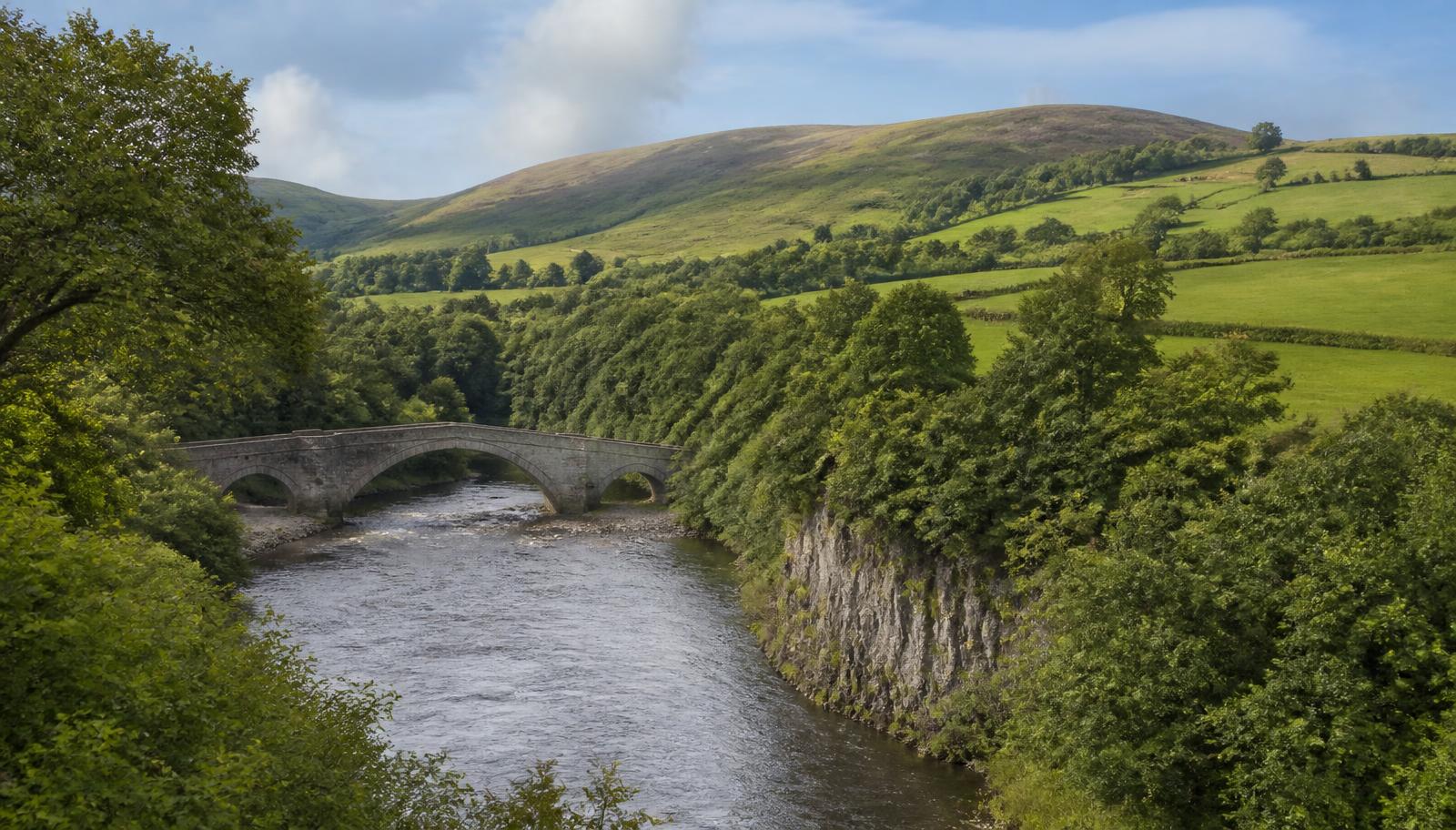 South Lanarkshire countryside with the Clyde valley, a stone bridge and rolling hills